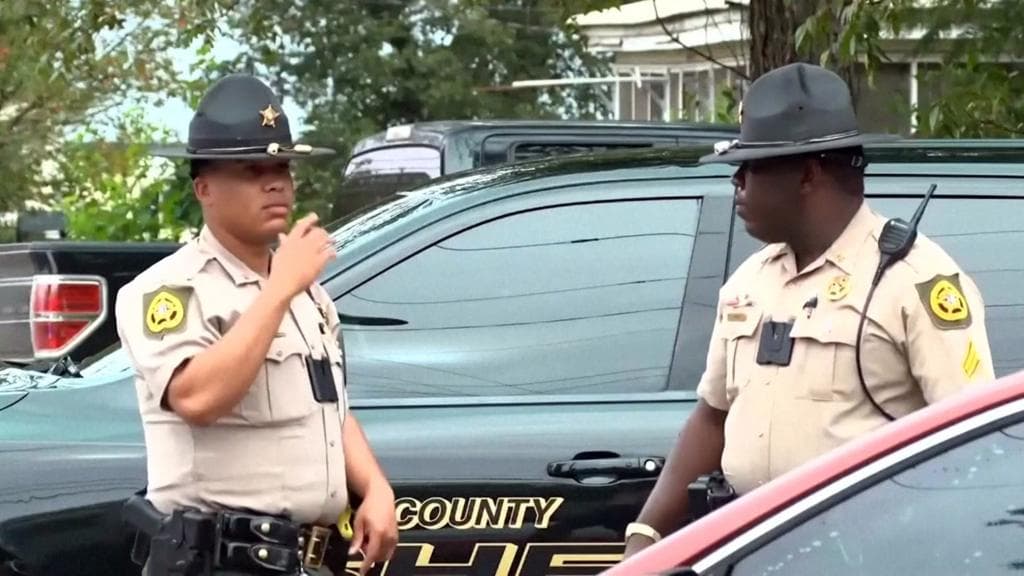 Georgia officials hunt for suspect in shooting that killed two and injured 35