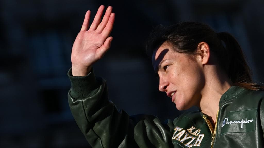 Emotional Taylor steps on the scales one final time