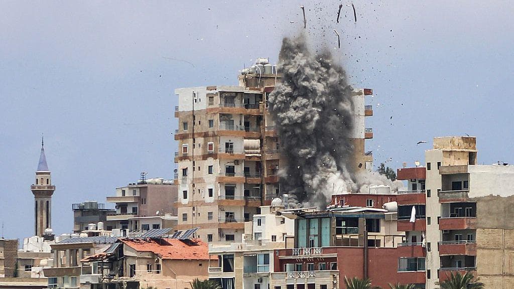 Israeli air strikes hit Lebanese city of Tyre despite Iranian warning to stop attacks